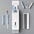 7-in-1 Keyboard Cleaning Kit with a variety of tools including a spray bottle, cleaning brush, and individual cleaning components laid out on a white background.