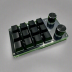 A compact 12-Key Macropad Mechanical Keyboard with a programmable rotary knob, featuring a transparent panel and green keycaps.